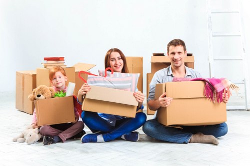 Packed household boxes ready for loading by a removal company in Edgware
