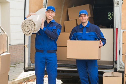 Local Edgware moving team handling boxes and furniture