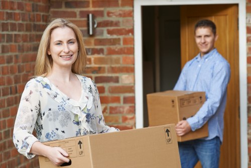 Secure van loading process showing careful packing and safety measures for moving items