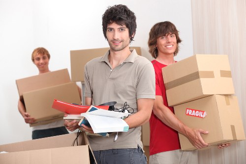 Local movers handling furniture and boxes in North West London