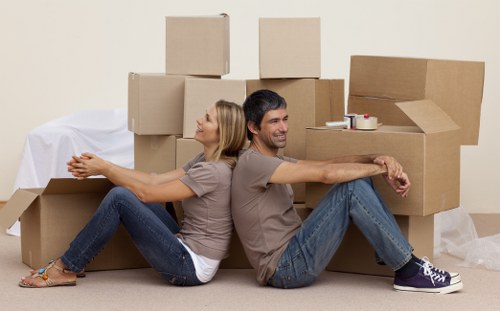 Removal team transporting furniture from an Edgware property