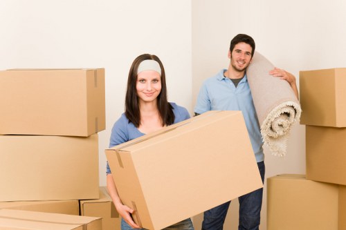 Boxes and furniture being moved from a flat with stairs