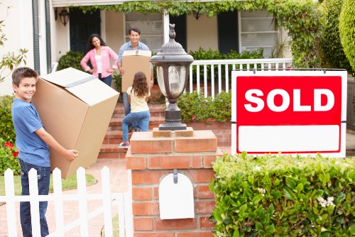 Packed moving boxes and furniture ready for removals in Edgware